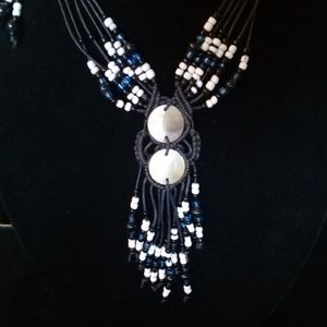 Hand beaded necklace with shell adornment